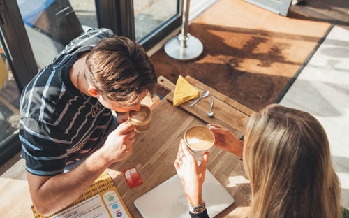 students drinking coffee at onsite cafe